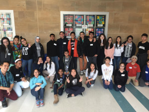 Middle and high school youth pose for a photo together after completing the guided tour. 